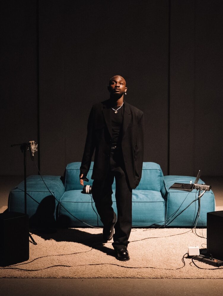 Omah Lay Bald Admire in A Studio Room